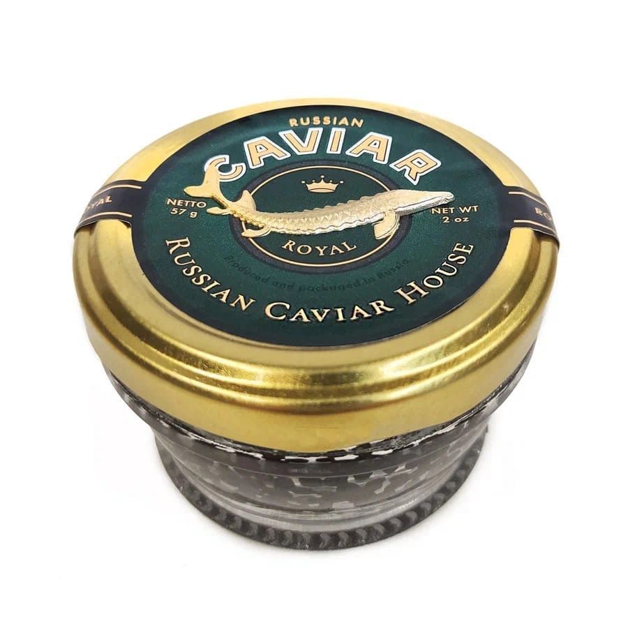 A jar of Russian Caviar House Royal caviar with a gold lid and green label.